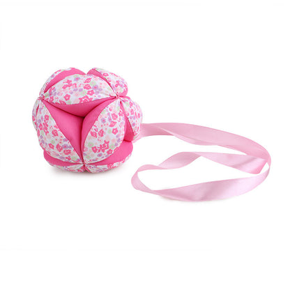 Baby hand catching cloth ball