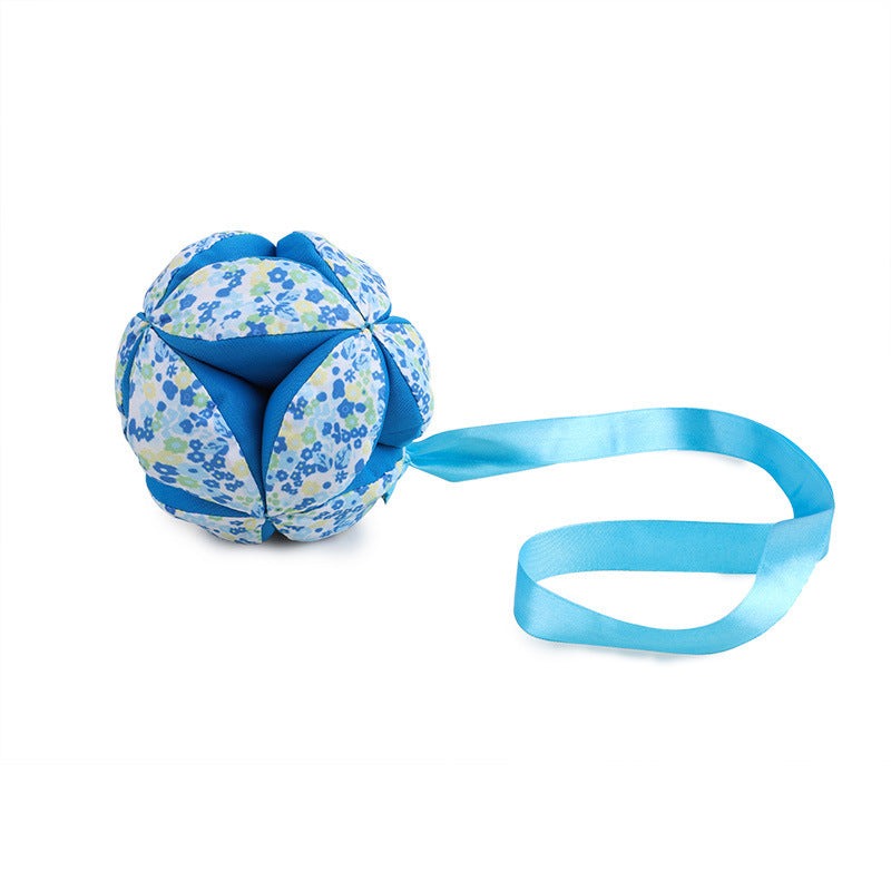 Baby hand catching cloth ball